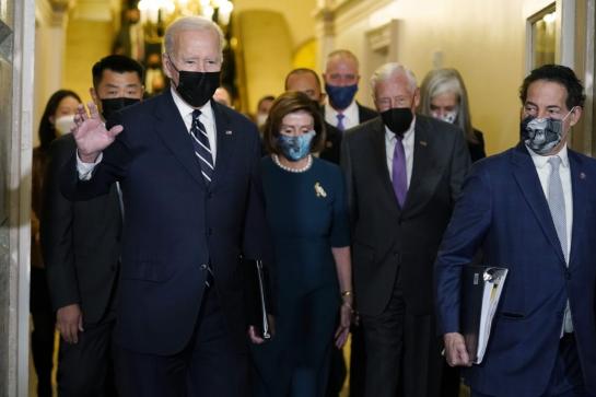 President Joe Biden walks in a basement hallway of the Capitol to meet with House Democrats, on Capitol Hill Washington, Thursday, October 28th, 2021