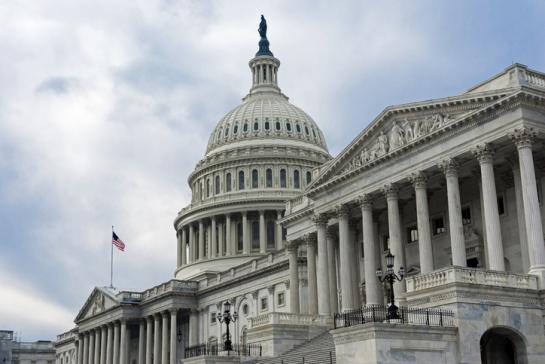 Photo of U.S, Capitol building against blue sky