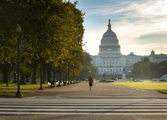 [Image of Capitol Building in the morning with a view of the National Mall gravel path in the foreground]