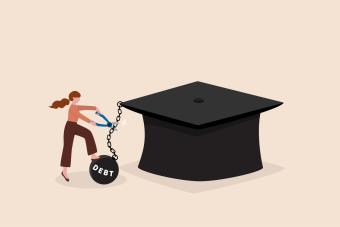 Person cutting a ball and chain off a graduation cap